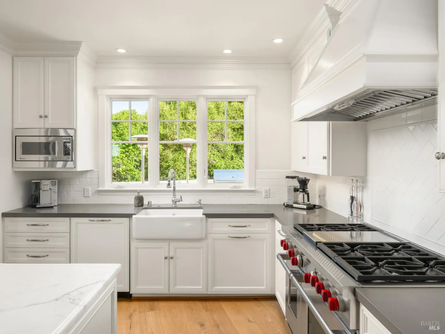 Kitchen with farmhouse sink and Wolf range