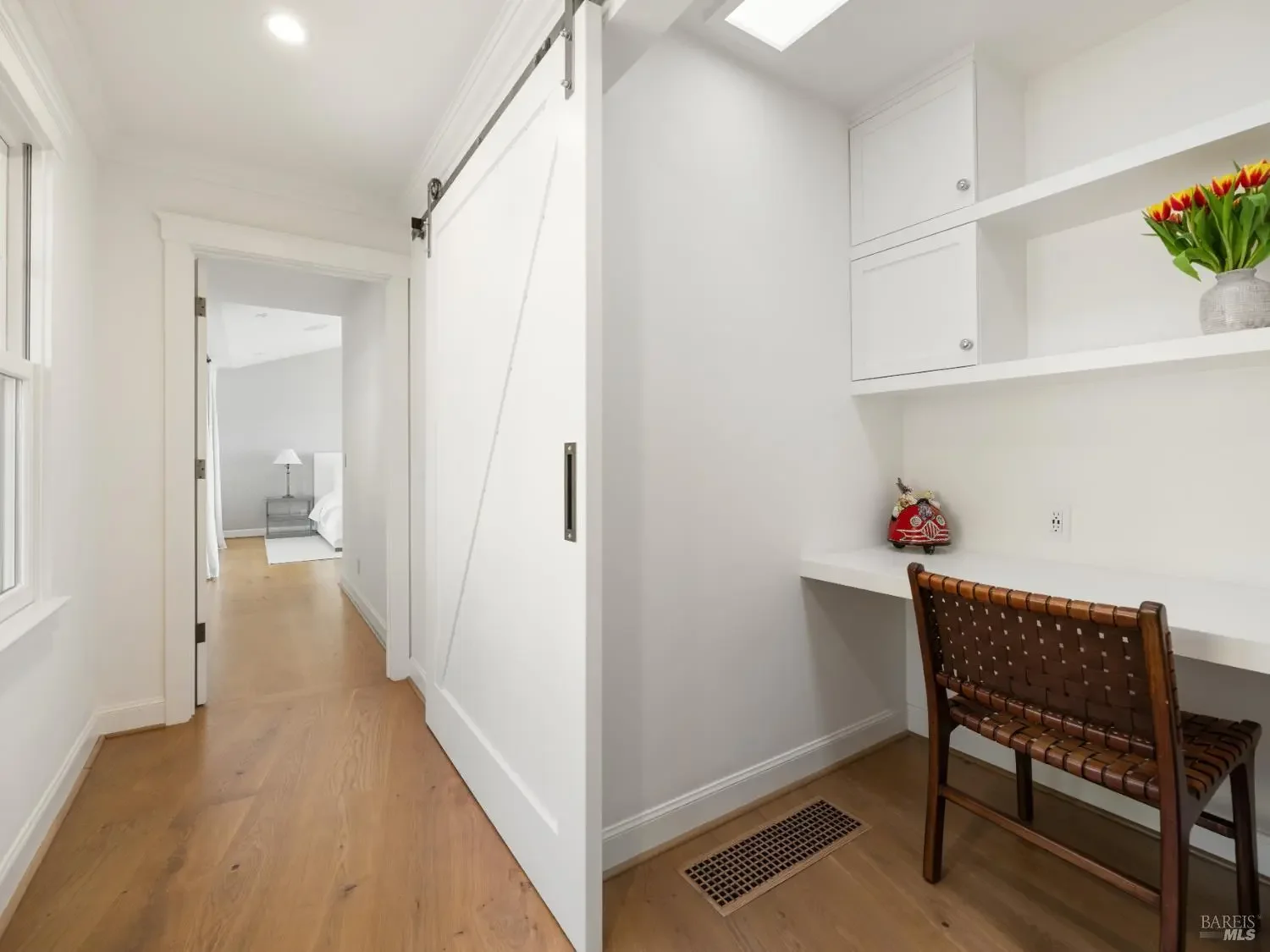 Hallway with barn door and reading nook