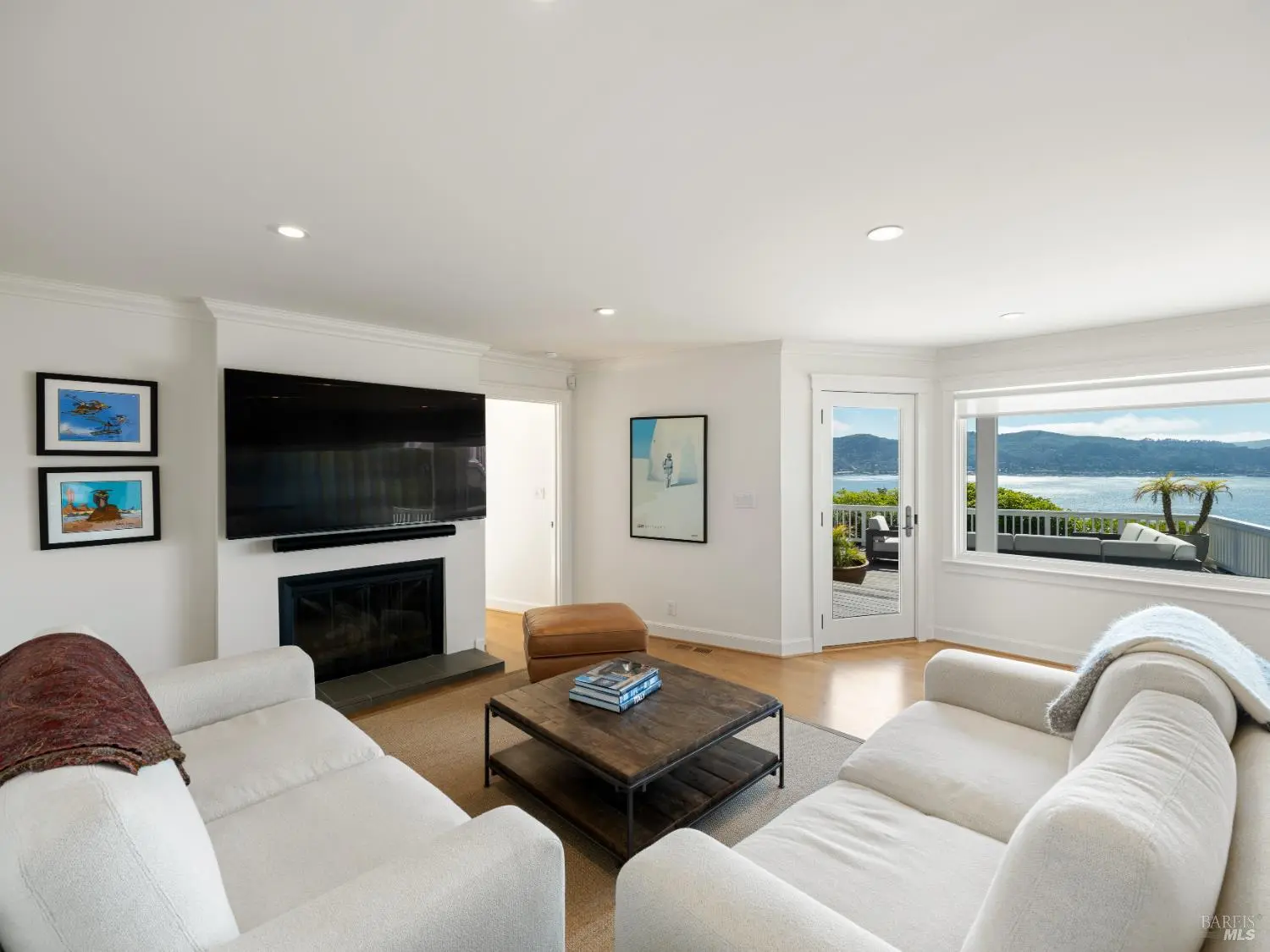 Secondary living room with fireplace and bay views