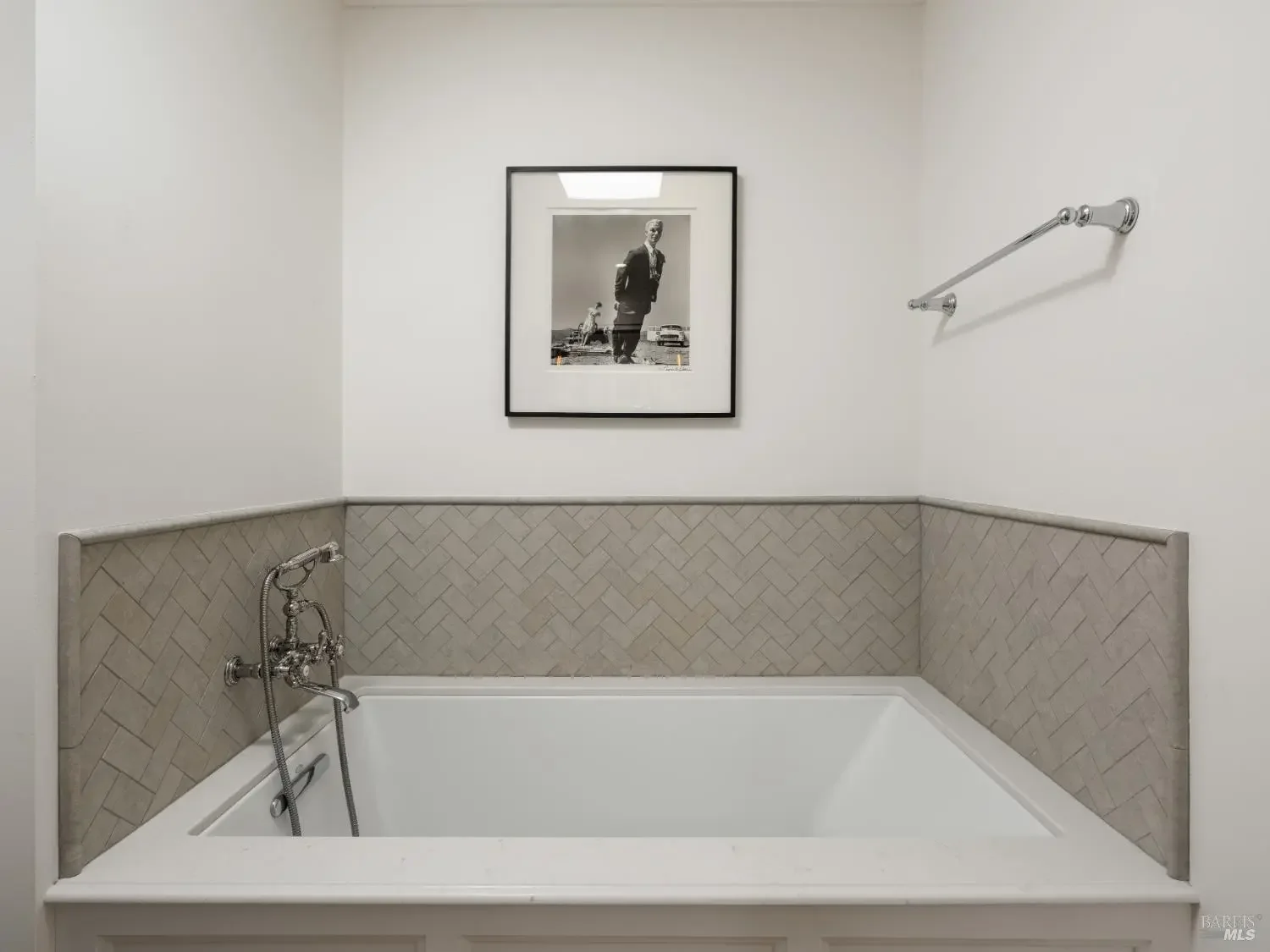Soaking tub with herringbone tile