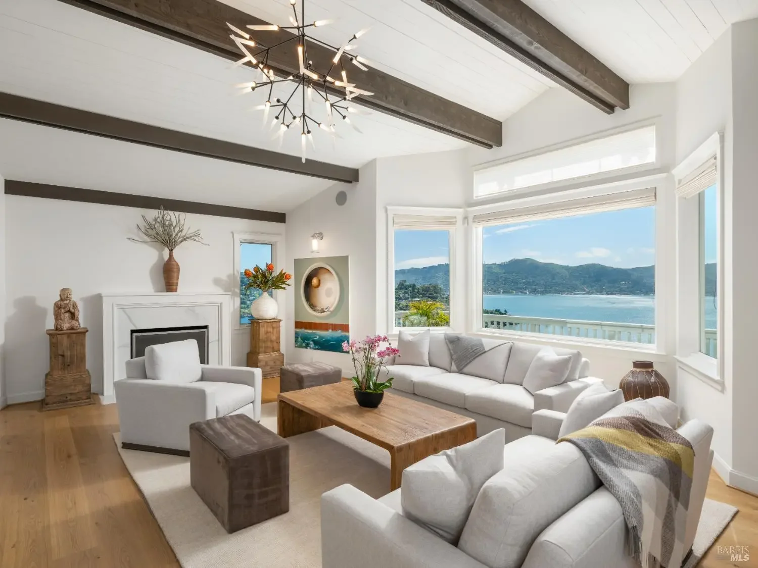 Living room with fireplace and bay view